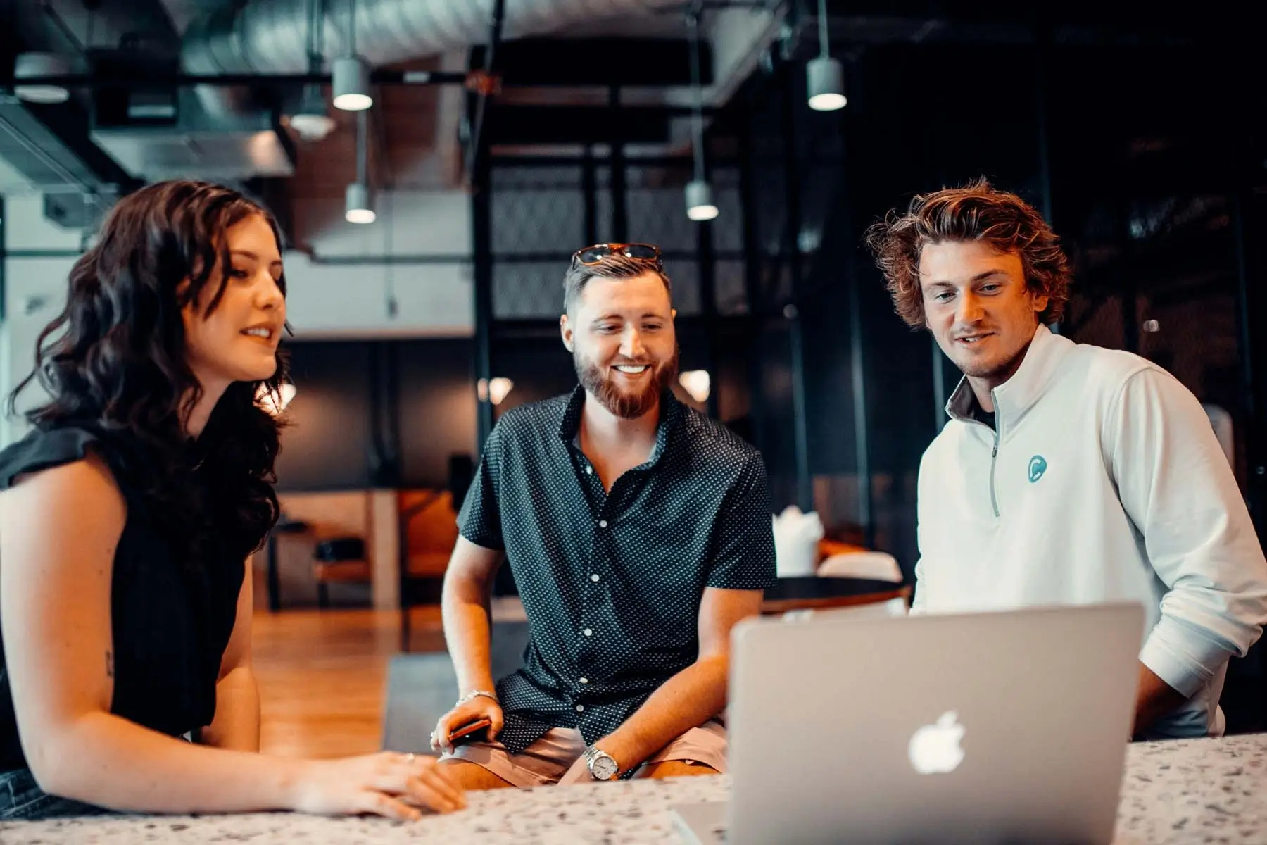 A group of workers with a laptop
