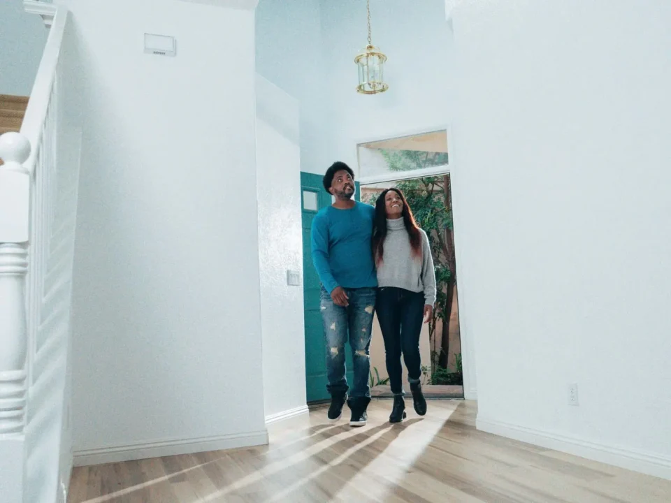 A couple entering a new home