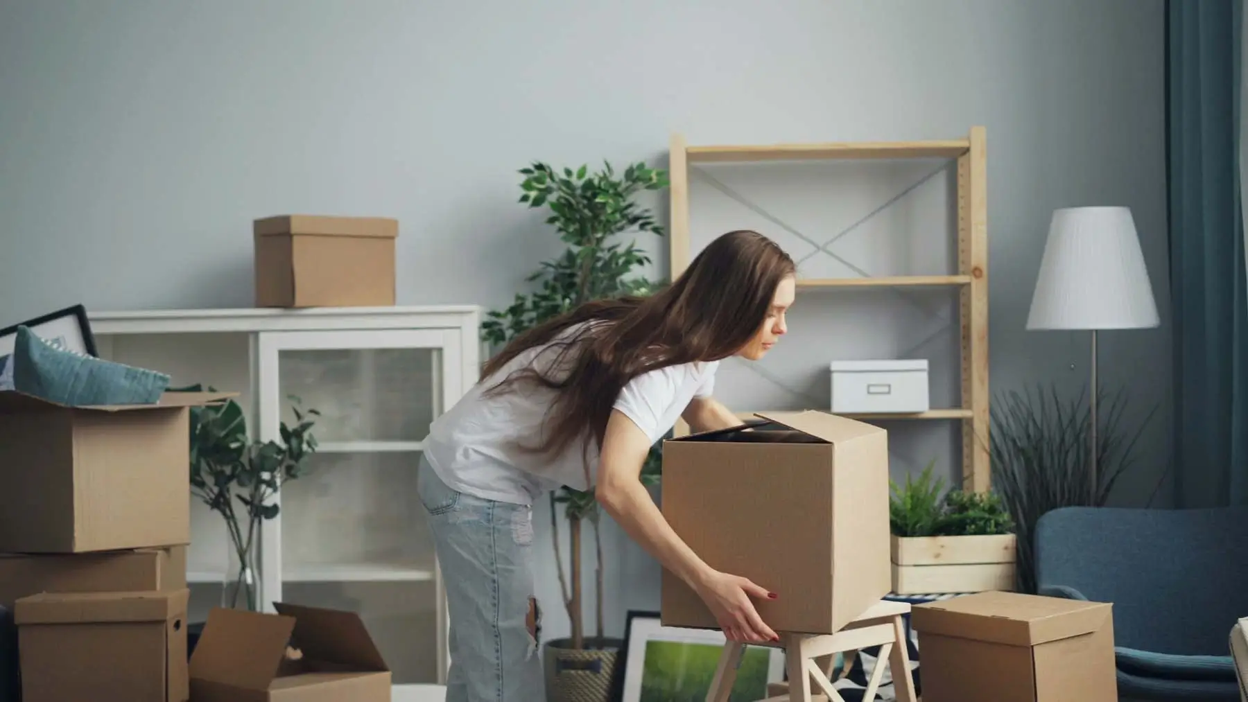 A woman moving into a house