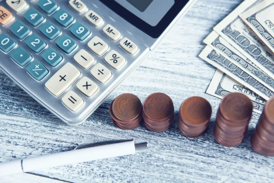 A calculator and some coins
