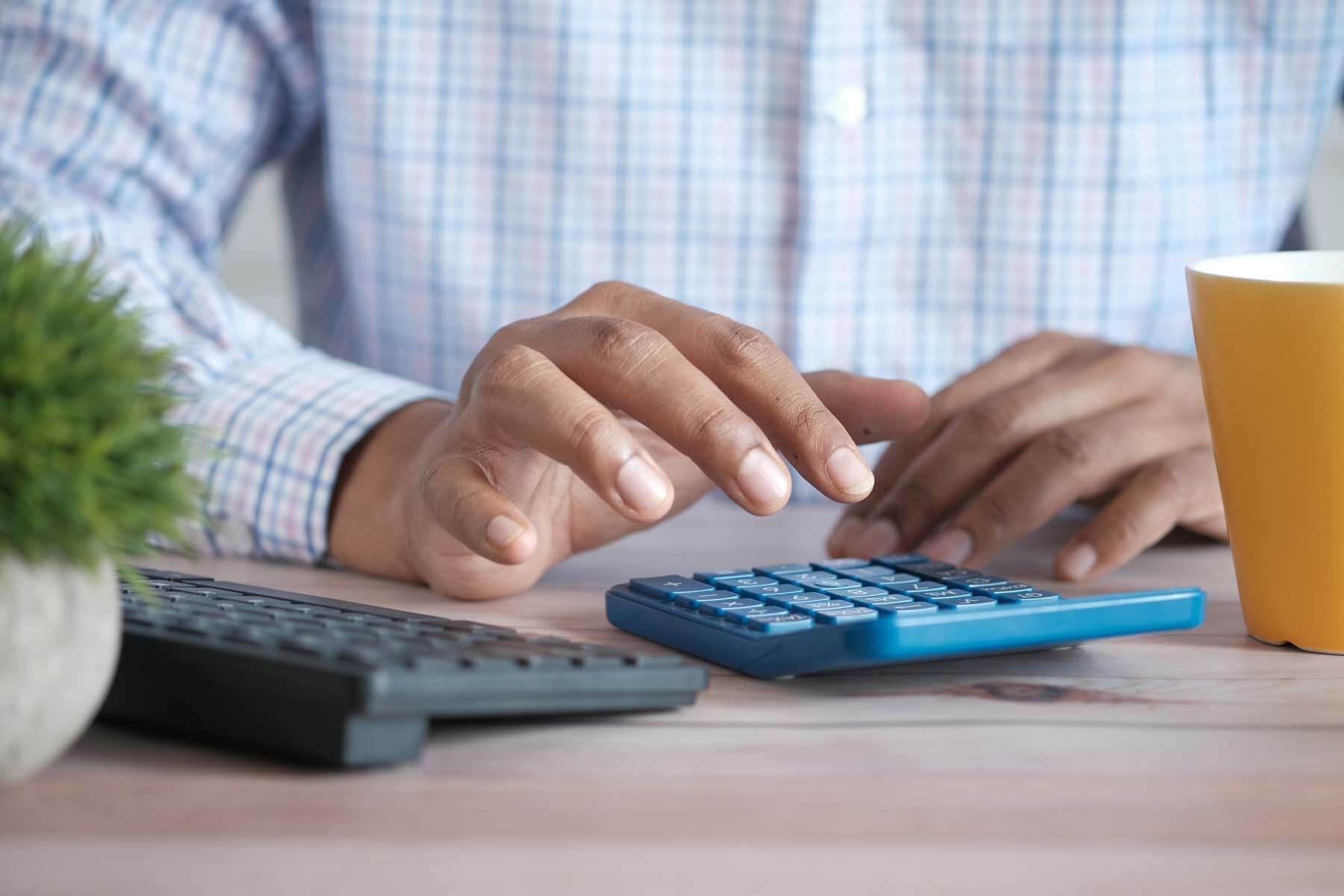 A man with a calculator